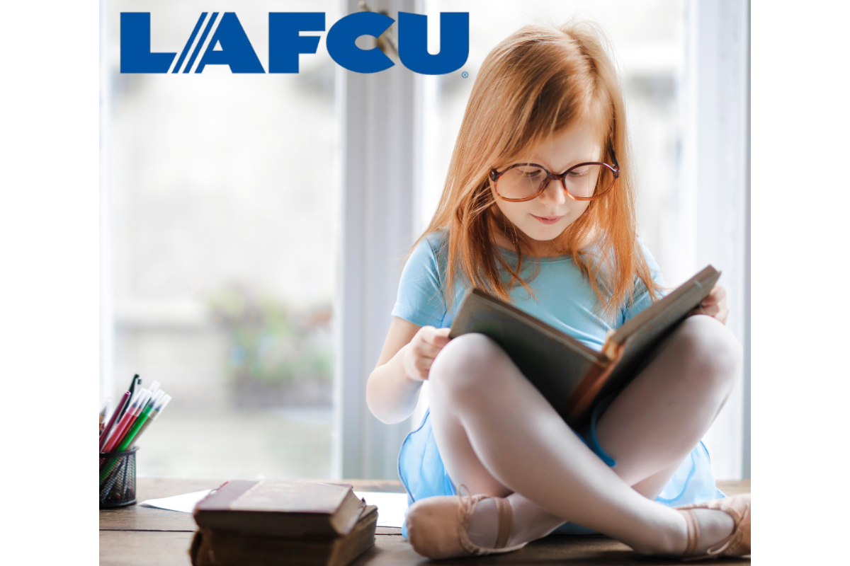 girl reading a book with lafcu logo