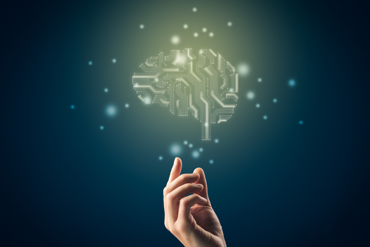 Hand reaching up to brain made with circuitry