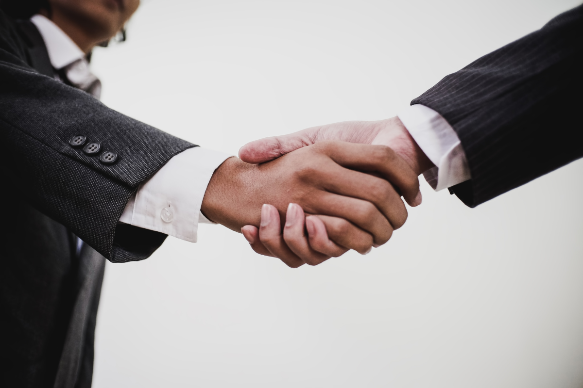 Two businesspeople shaking hands