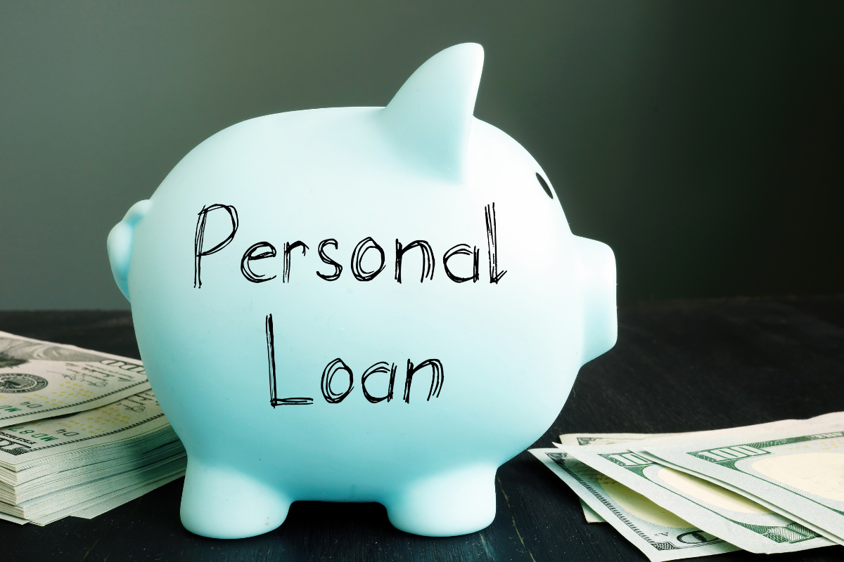 Blue piggy bank with "personal loan" written on it