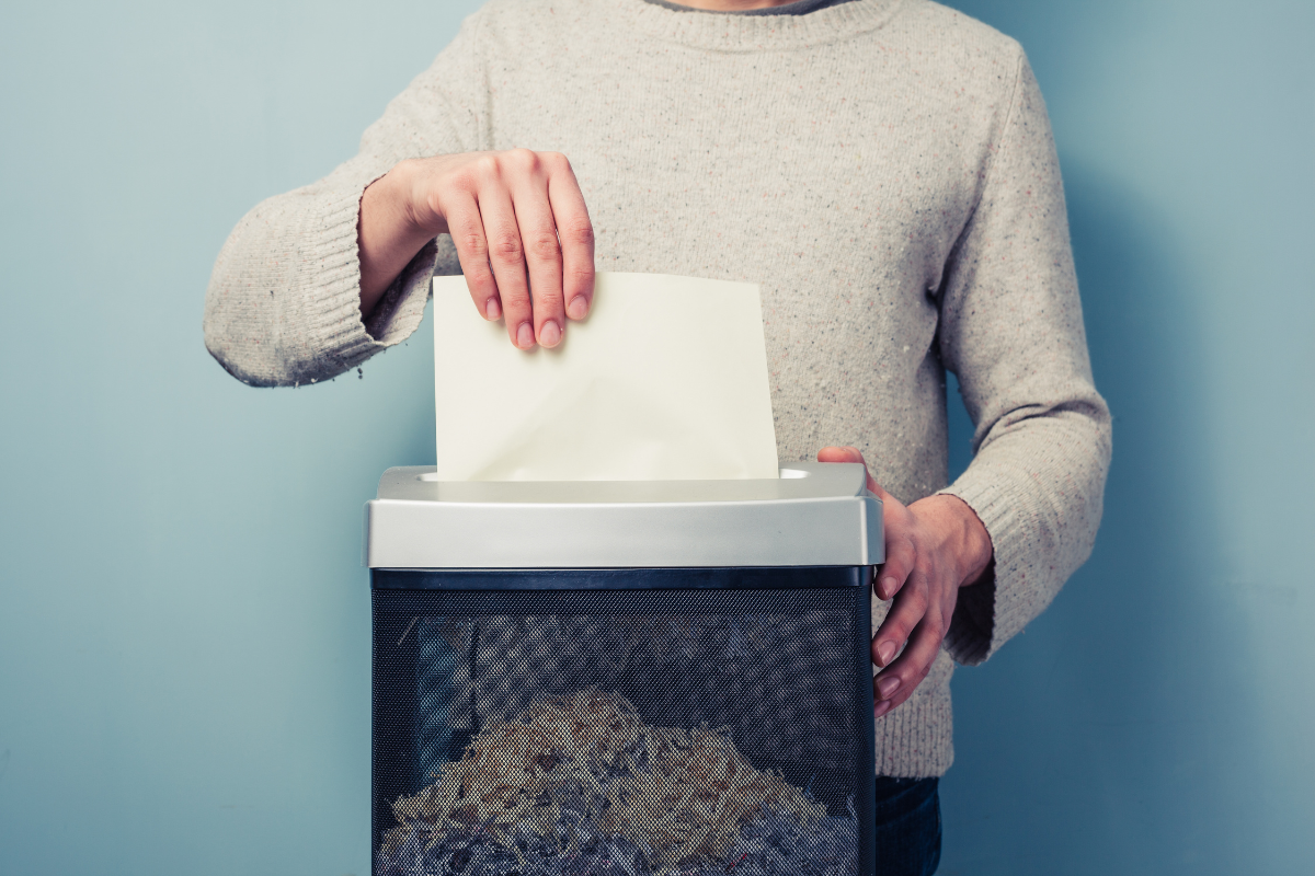Person using paper shredder