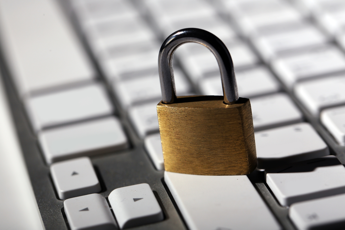 Padlock sitting on top of computer keyboard