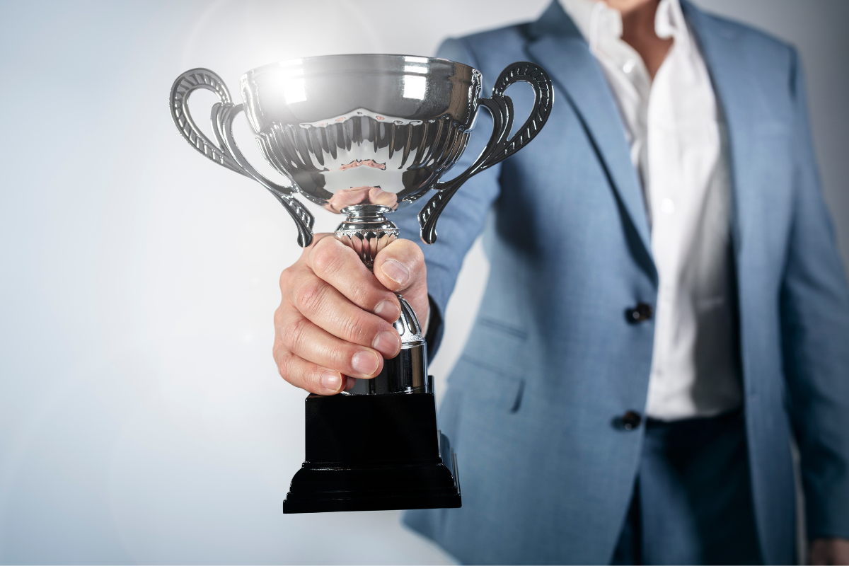 person holding trophy