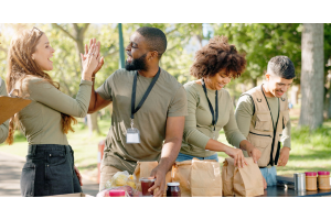 Volunteers working and giving high fives