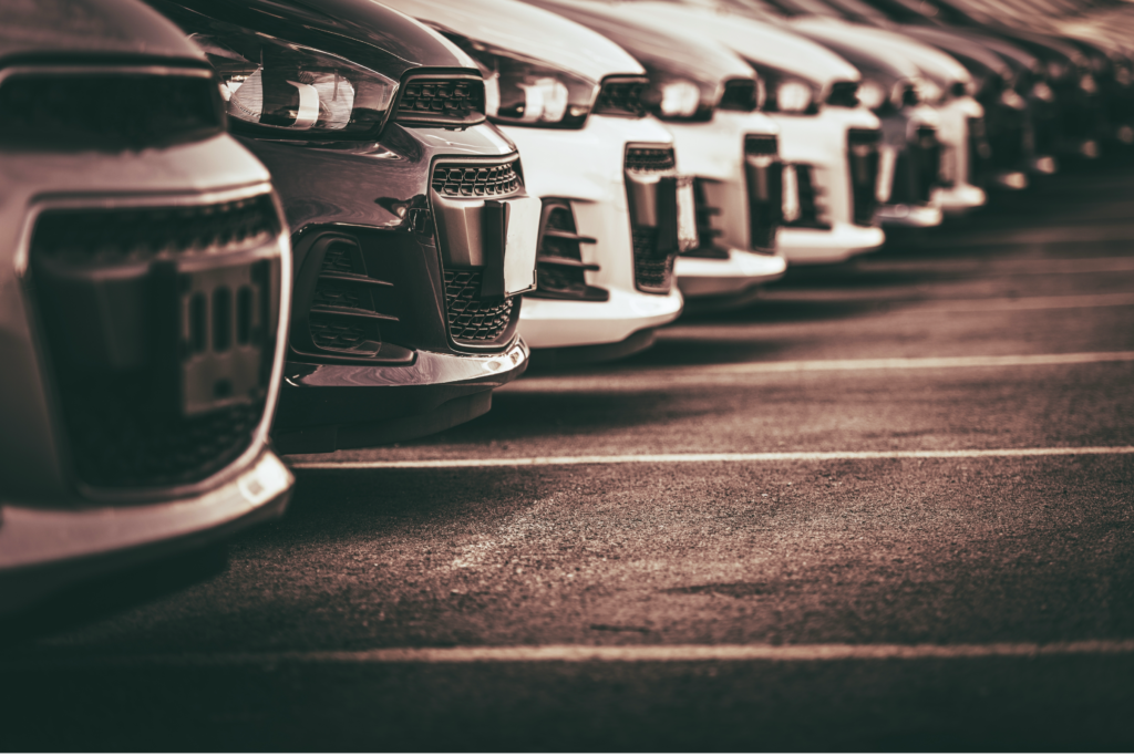 Car Sales and Loan Industry Concept. Row of Brand New Vehicles in Stock.