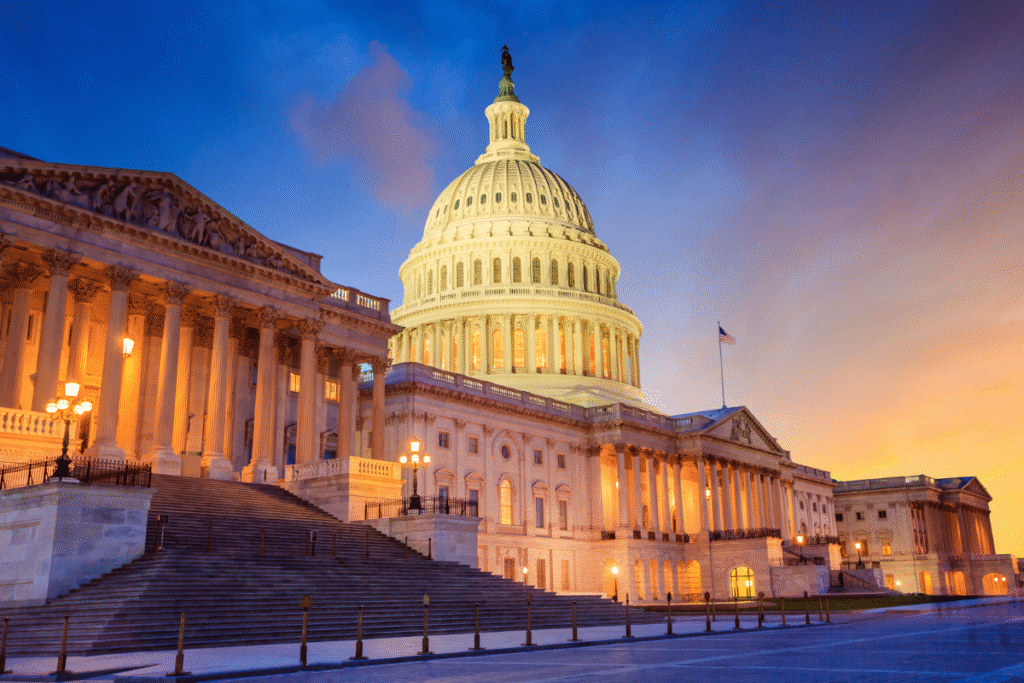 The United States Capitol building with the dome lit up at night