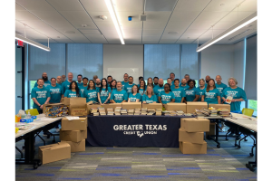 Greater Texas Credit Union- Employees prepping books group photo