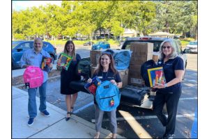 SchoolsFirst FCU- Employees with backpacks group photo