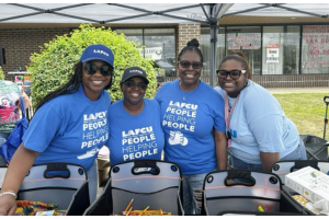 (From left to right) Volunteers Tamera Carter, Shelia Scott, Clarice Lewis and LaToya Scott, were all smiles at LAFCUs Back-to-School Extravaganza as they gave away over 300 backpacks filled with school supplies to students.