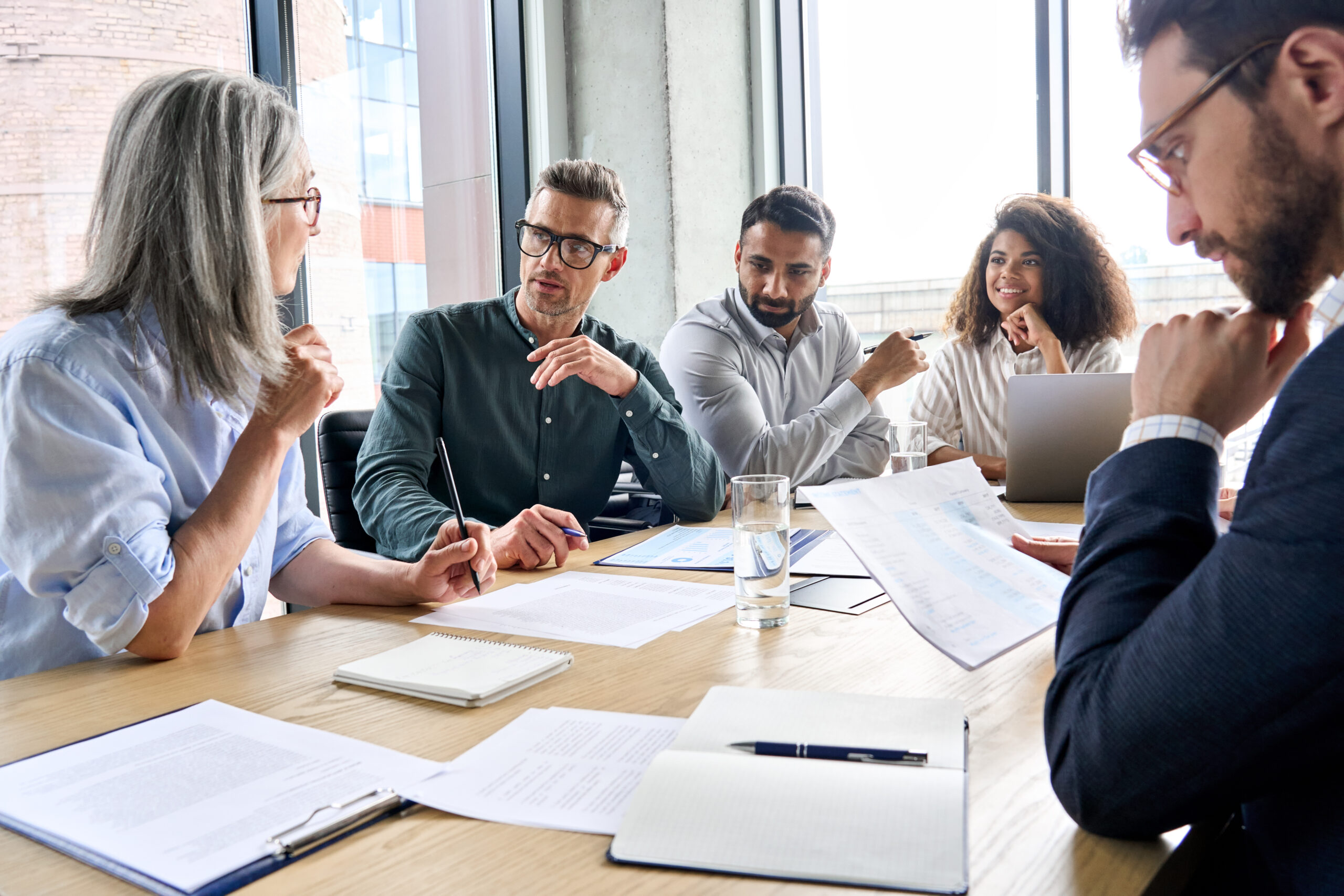 Group of coworkers working at table