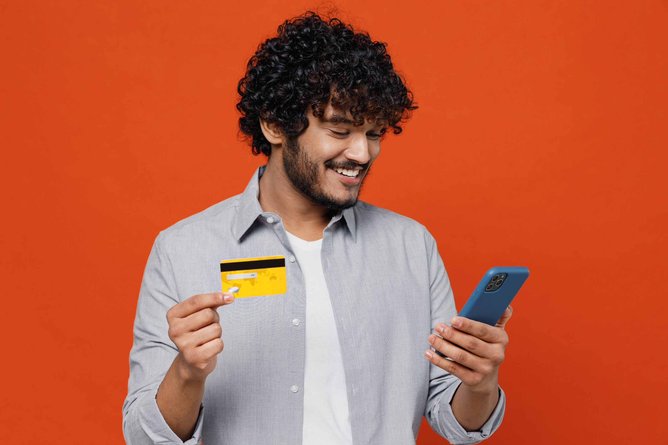 Man holding credit card and smartphone