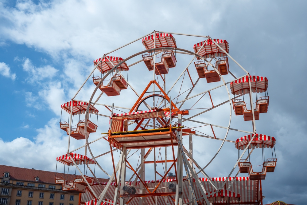 Red and white ferris wheel at local fairground