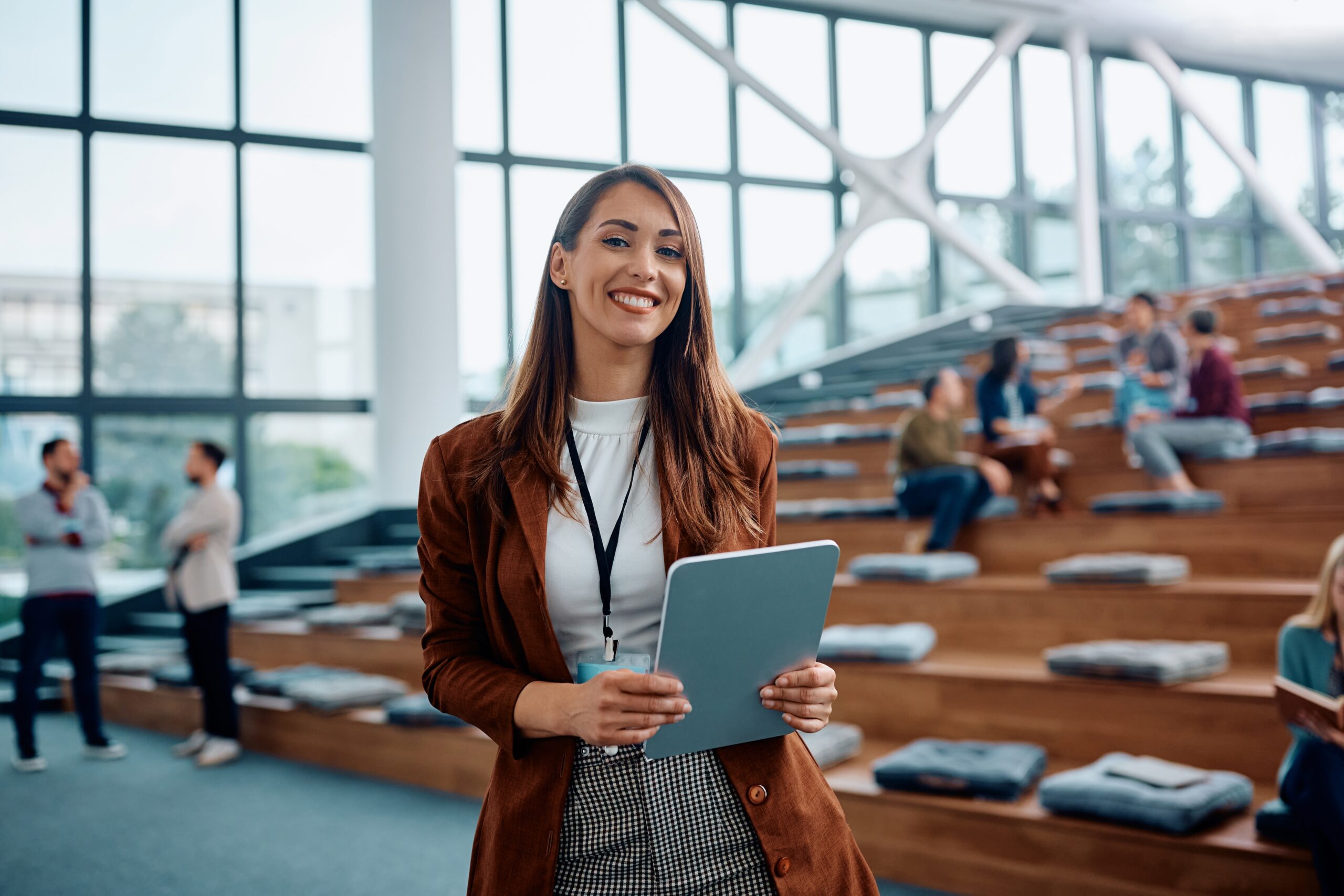 Woman holding tablet in seminar room