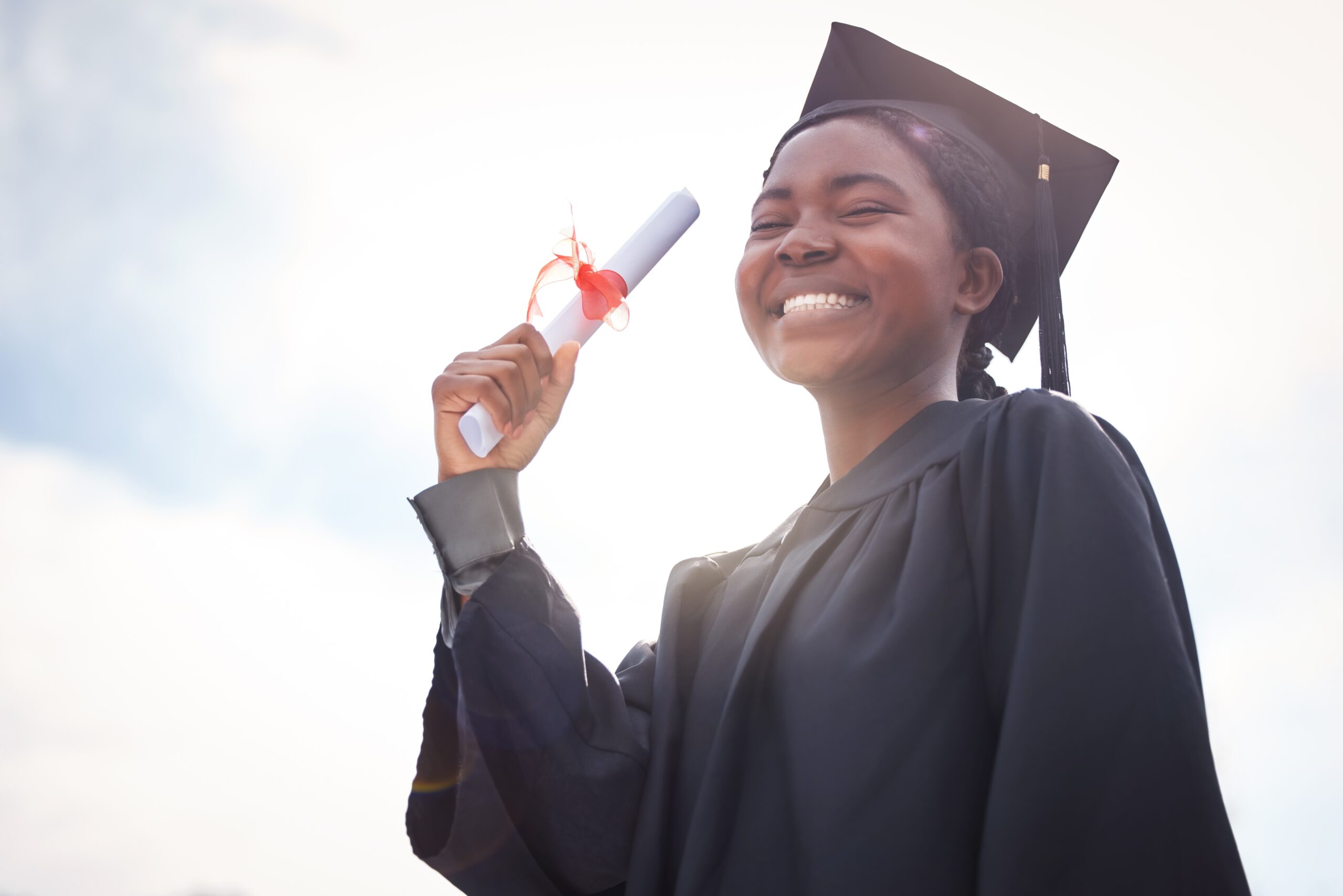 Woman college graduate holding a diploma