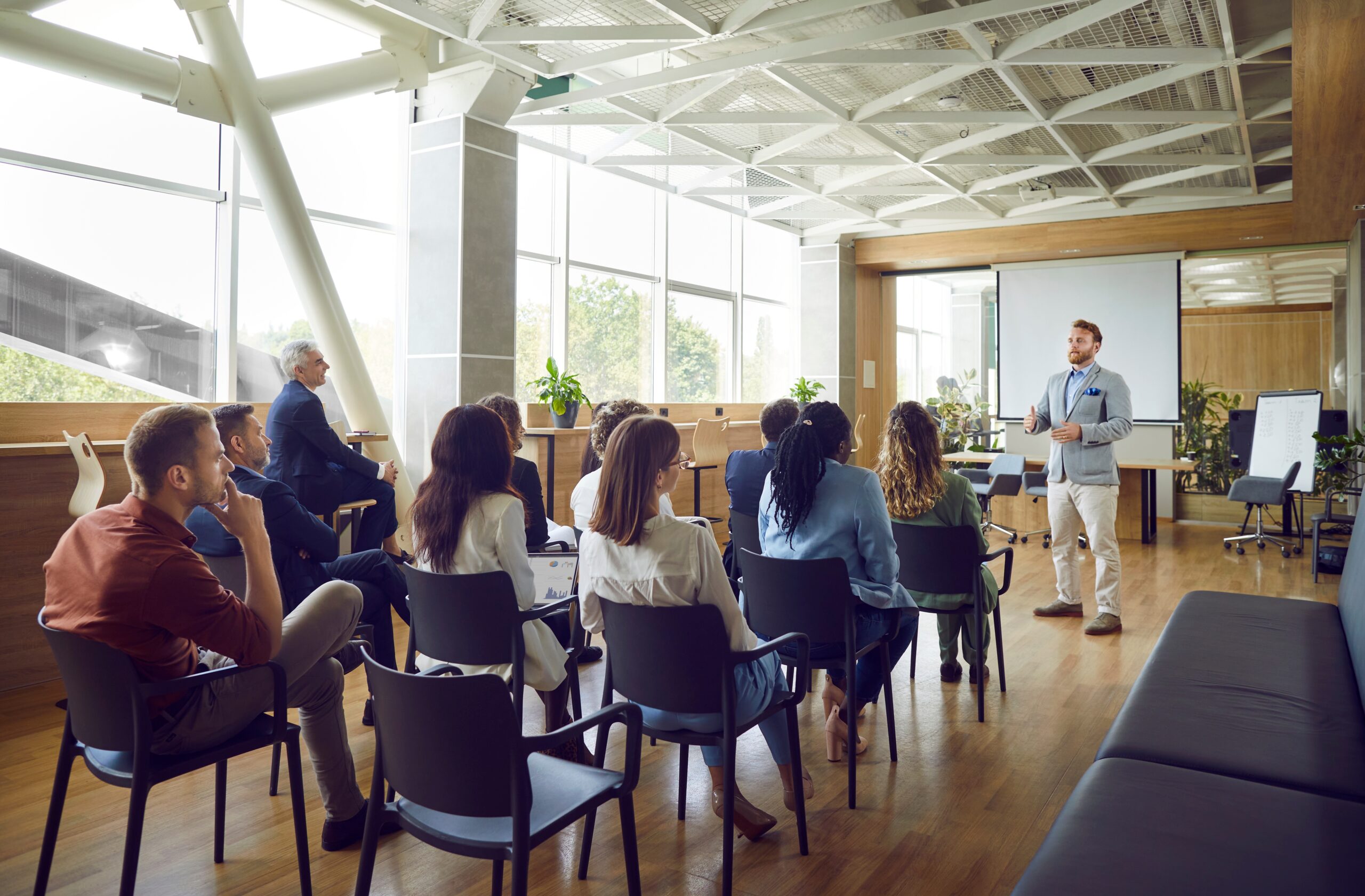 Seminar being held, man speaking in front of group