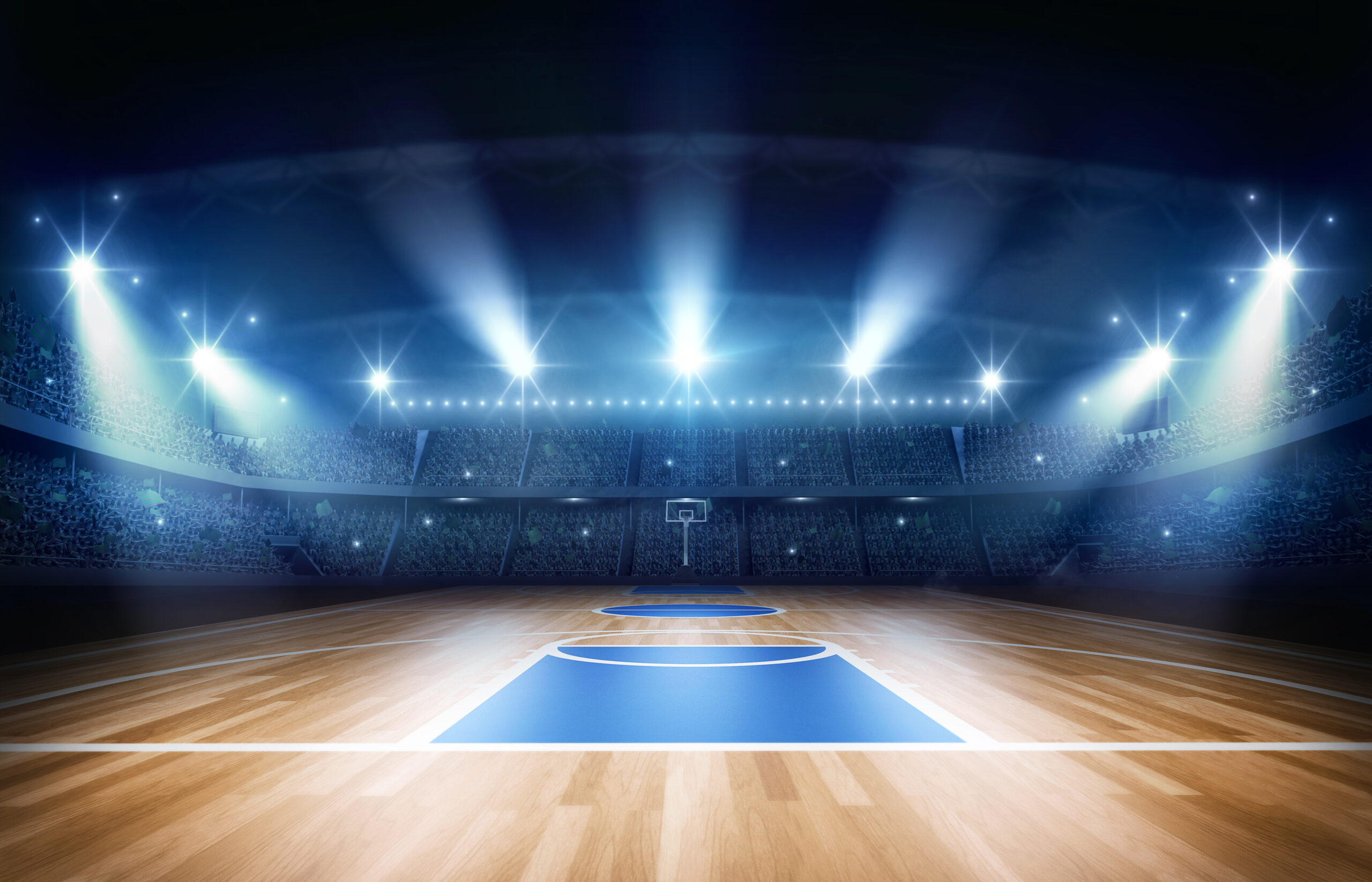 Basketball court lit up by spotlights