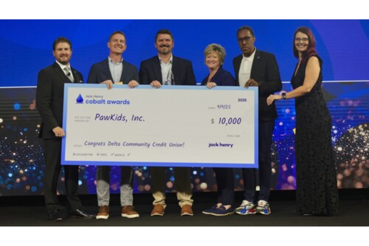At the Cobalt Awards, Delta Community Credit Union and Jack Henry representatives present a $10,000 check benefiting PAWKids.