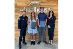 (L-R) San Diego Police Department Chief and former Wheelhouse Supervisory Committee Member Scott Wahl, Wheelhouse Sustainability Scholarship Recipients Lorelei Abboud and Leonardo Garcia, and Wheelhouse President/CEO Lisa Paul-Hill during a scholarship presentation at Wheelhouse Credit Union.