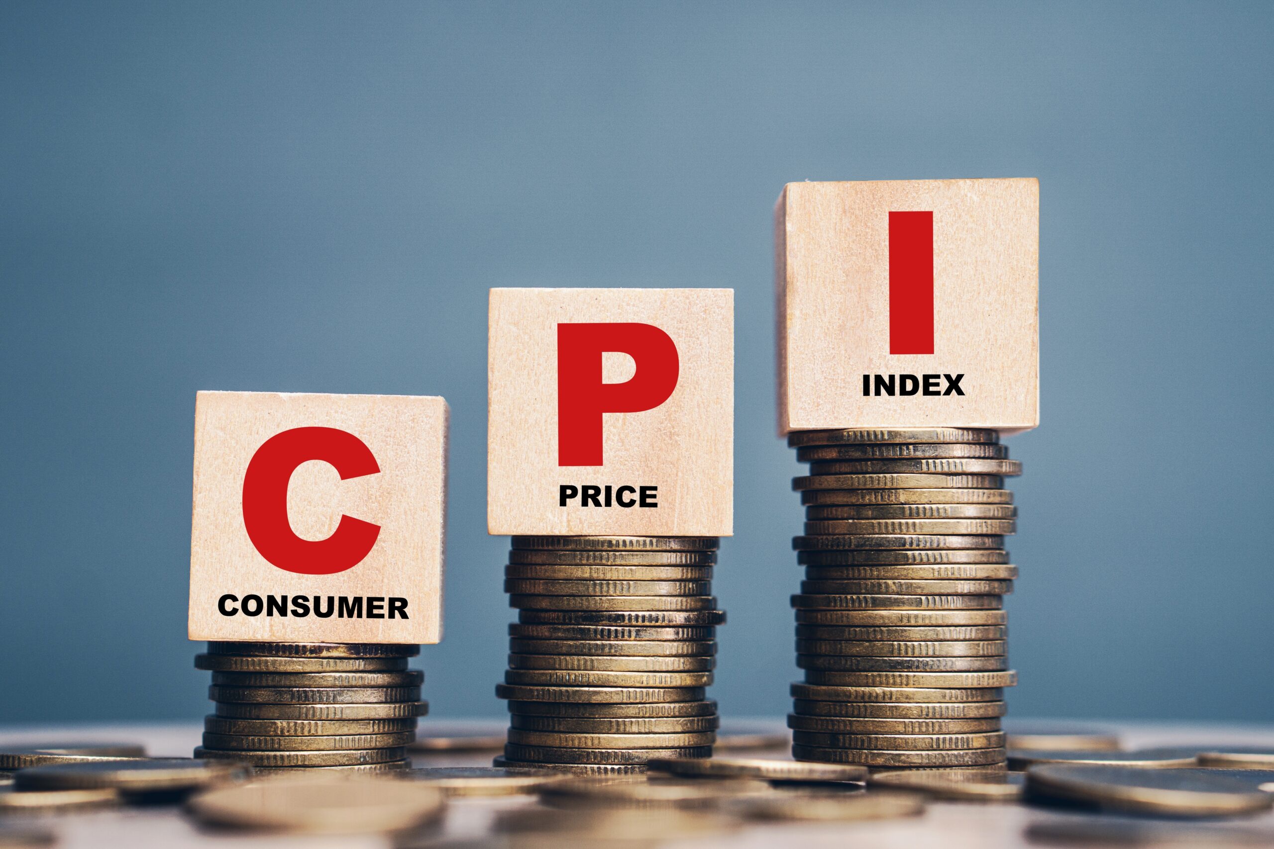CPI, consumer price index symbol.Wooden block with words CPI, consumer price index on dollar bills. Business and CPI, consumer price index concept.