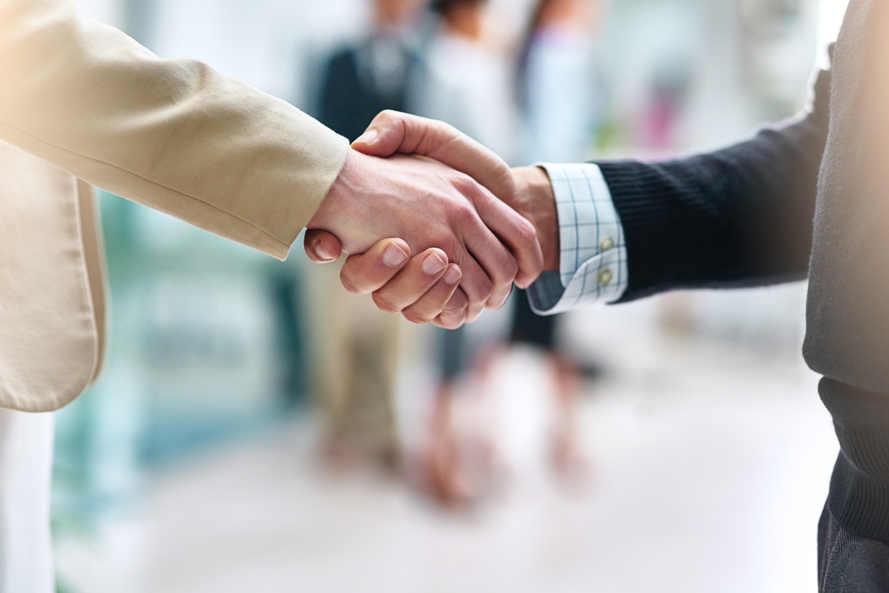 Two businesspeople shaking hands