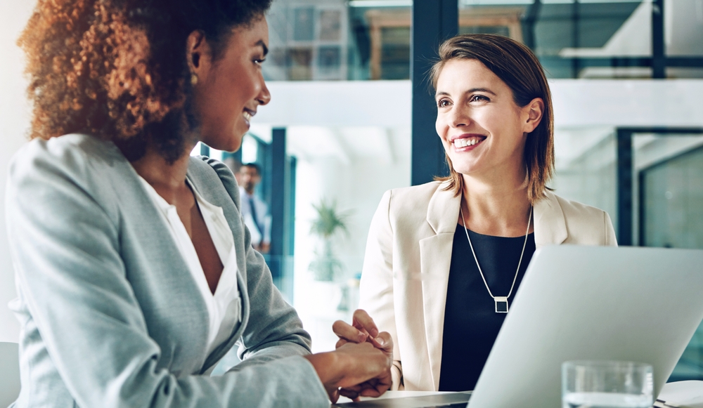 Two businesswomen shaking hands