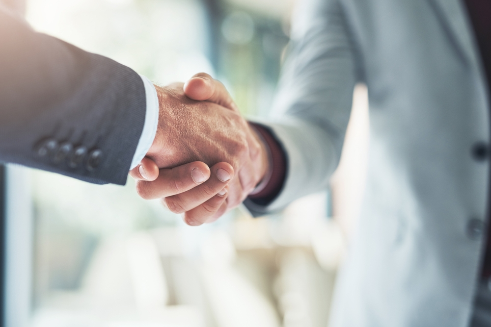Two businesspeople shaking hands
