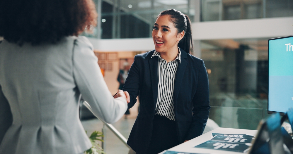 Two businesswomen shaking hands