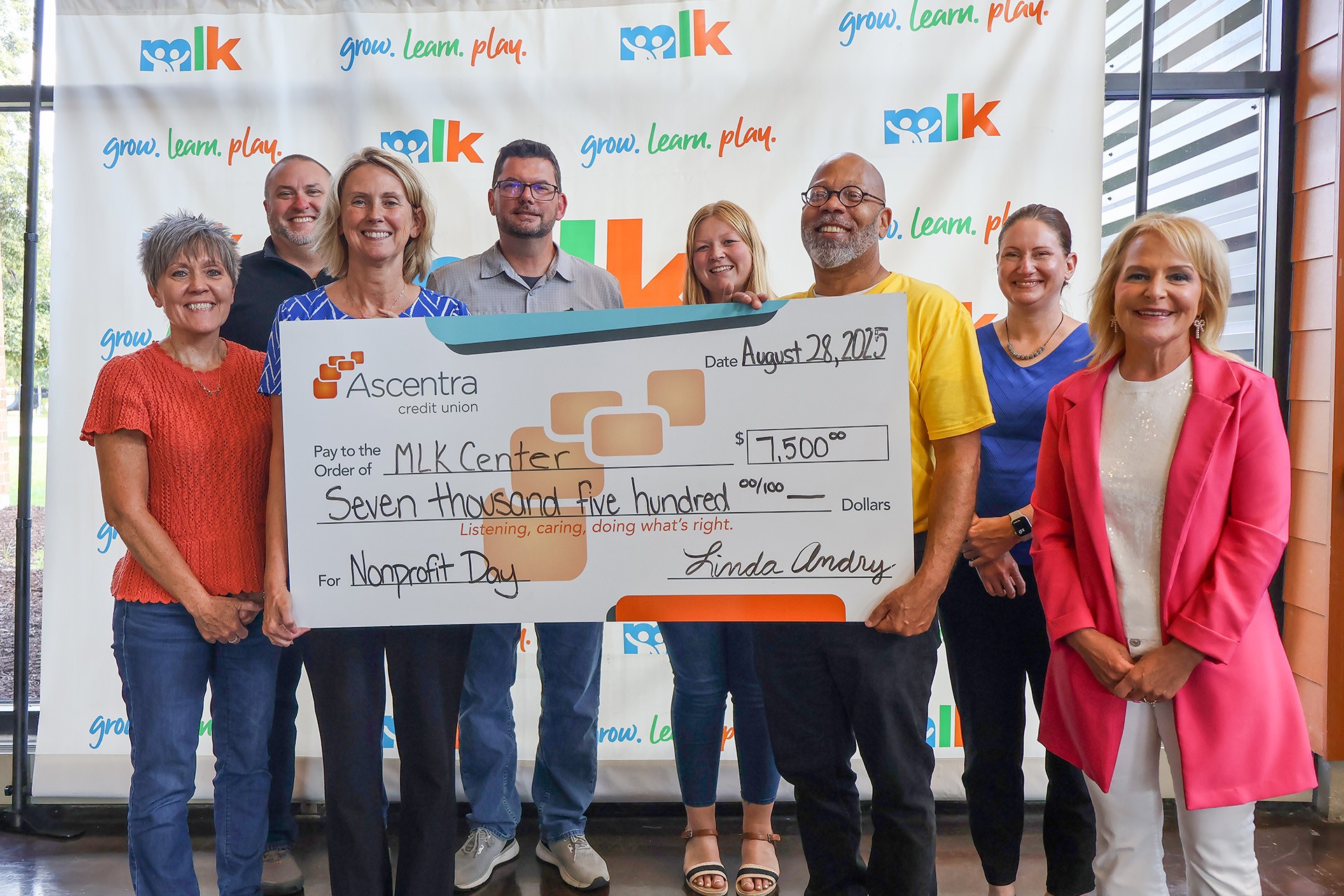 Ascentra Credit Union presents the MLK Center with a $7,500 donation in celebration of National Nonprofit Day and their 75th Anniversary on August 28, 2025. Pictured are (left to right): Shelly Ridgeway EVP and COO, Ascentra Credit Union; Barry Shaw, Community Partner Director, Ascentra Credit Union; Linda Andry, President and CEO, Ascentra Credit Union; Matt Bennett, Digital marketing Specialist, Ascentra Credit Union; Rachel Forman, Marketing Coordinator, Ascentra Credit Union; Jerry Jones, Executive Director, Martin Luther King Center; Beth Grabin, CFO, Ascentra Credit Union and Jennifer Naeve, SVP and CMO, Ascentra Credit Union.