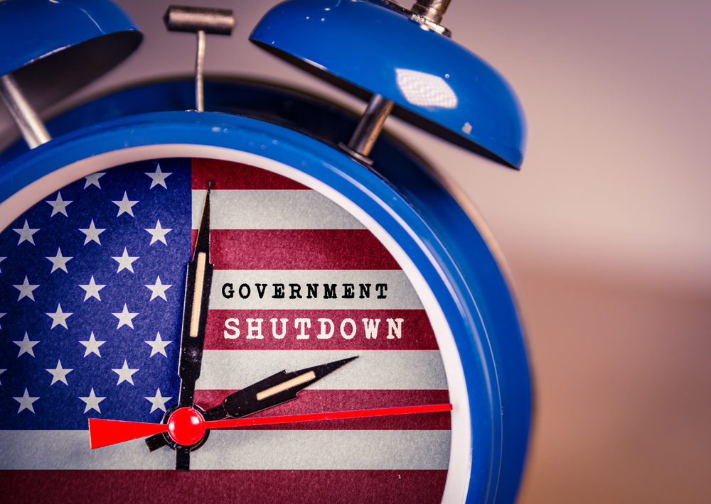 Blue alarm clock with American Flag design and "Government Shutdown" inside of clock