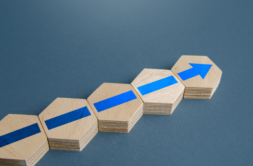Wooden hexagonal blocks forming an arrow