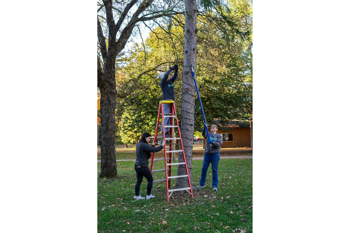 WESTconsin employees volunteering at Irvine Park to string up Christmas Lights for an annual display in Chippewa Falls, WI