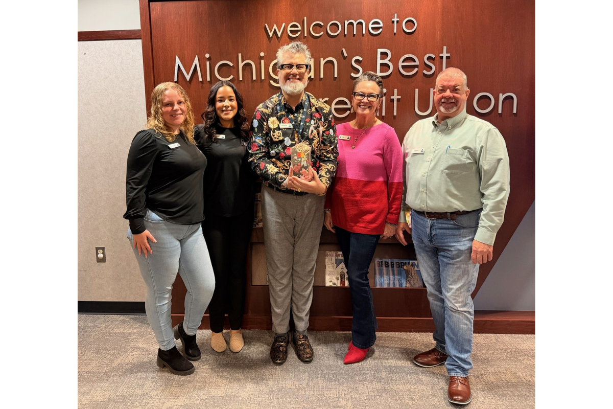 OMNI Community Credit Union team members with the Mastercard “Doing Well by Doing Good” Award, honoring the impact of the OMNI Gives Back Program.