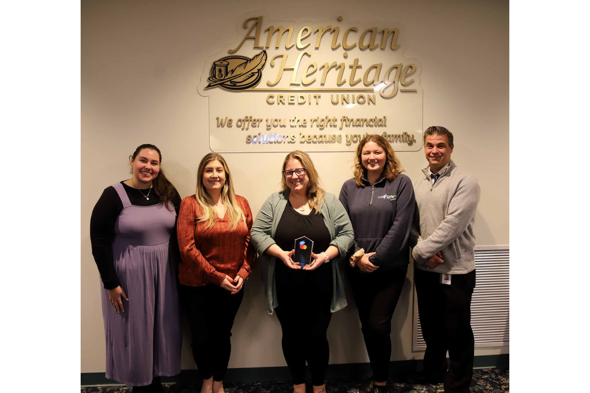 American Heritage associates stand with Mastercard’s 2025 “Doing Well by Doing Good” Award. (Pictured from left to right: Jane Lulko – Adopt-A-Family; Rebecca Londo – Adopt-A-Family; Laura Goodman – Adopt-A-Family; Maggie Burke – Kids-N-Hope Foundation; Tom Beck – Green Team)