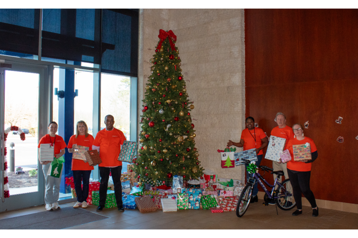 First Harvest’s Charitable Journey Committee and Executive Leadership Team displays over 150 gifts, which will be distributed to six local Southern New Jersey families.
