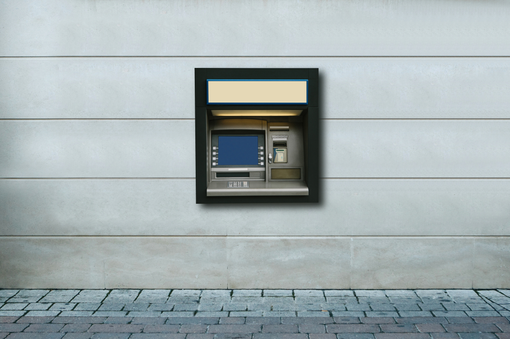 ATM machine embedded into outside wall of building