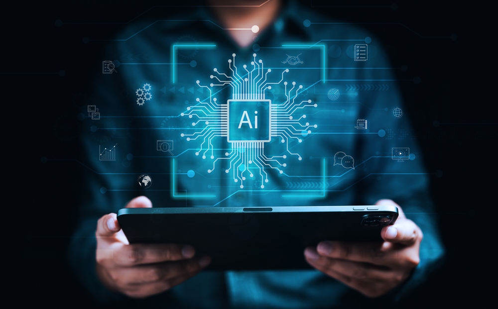 "AI" with circuitry and other graphics above tablet