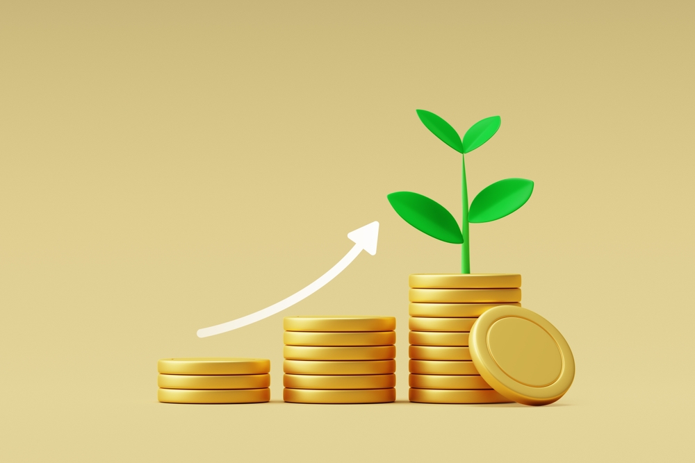 Growing stacks of coins; sprout growing out of stack of coins