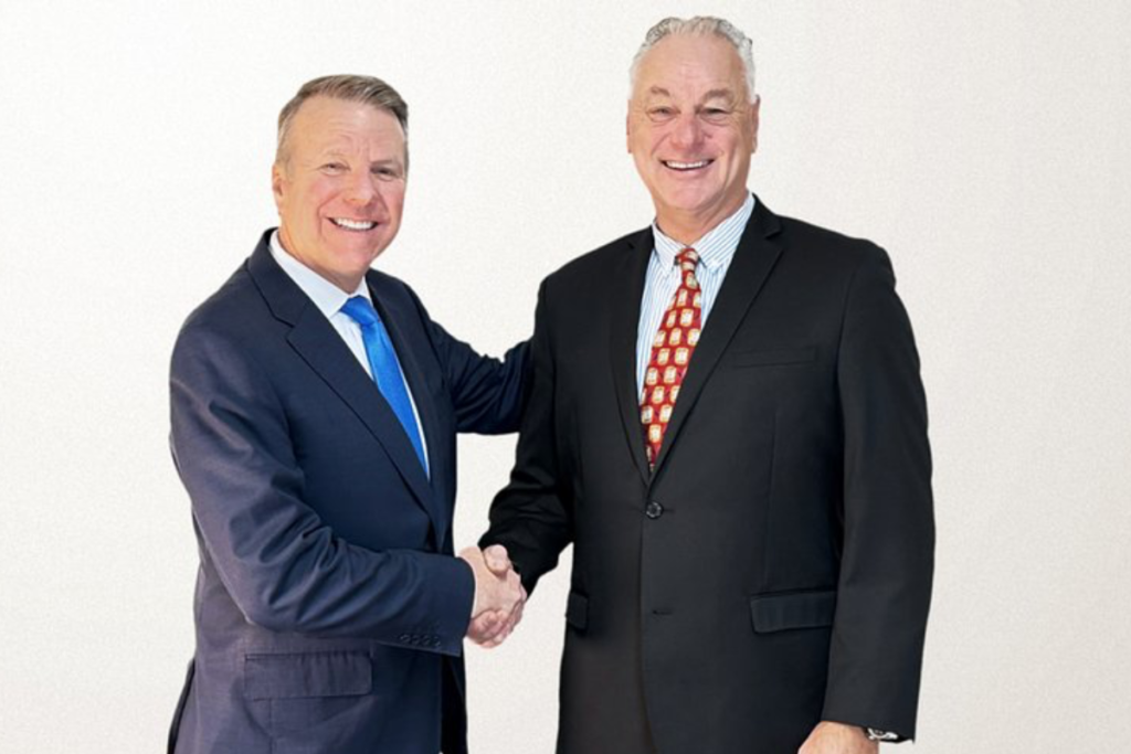 BrightBridge President & CEO John J. Howard (left) and Arrha President & CEO Mike Ostrowski shaking hands