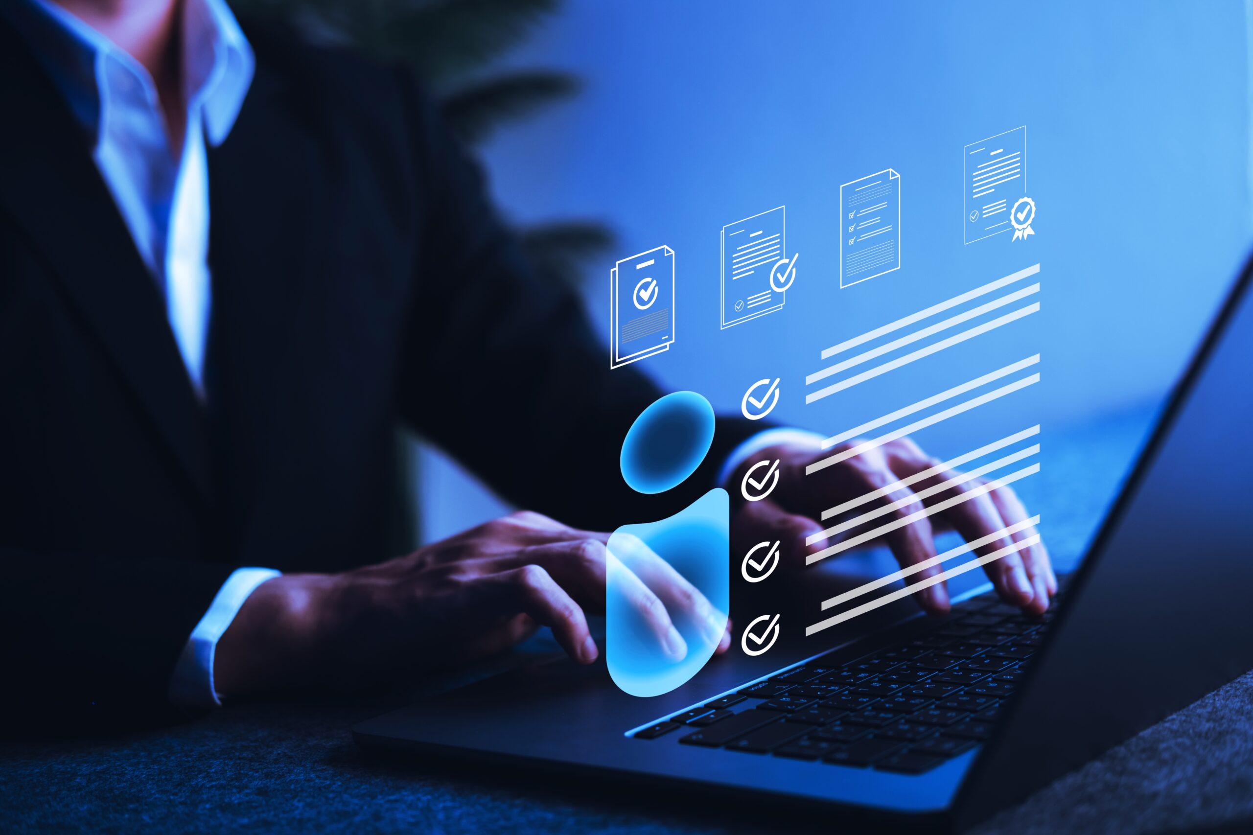 Businessman verifying digital personal profile data on laptop screen, illustrating identity verification, digital onboarding, and personal information security technology.