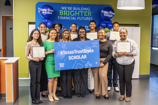Scholarship recipients from the University of Texas at Arlington, Tarrant County College and Paul Quinn College attended a private reception at Texas Trust Credit Union. Pictured in front left to right: Sonali Mittal (University of Texas at Arlington), Sydney Gilmore (Paul Quinn), Arielle Clayborne (Paul Quinn), Sarina Watson (Paul Quinn), Lacey Demus  (Tarrant County College), Lailah Washington (Paul Quinn. Back row (All Paul Quinn students): Makeda Montgomery, Jakayla Morrow, Kiera Trotter, Dariah Robinson-Bates, and Alexander Warren