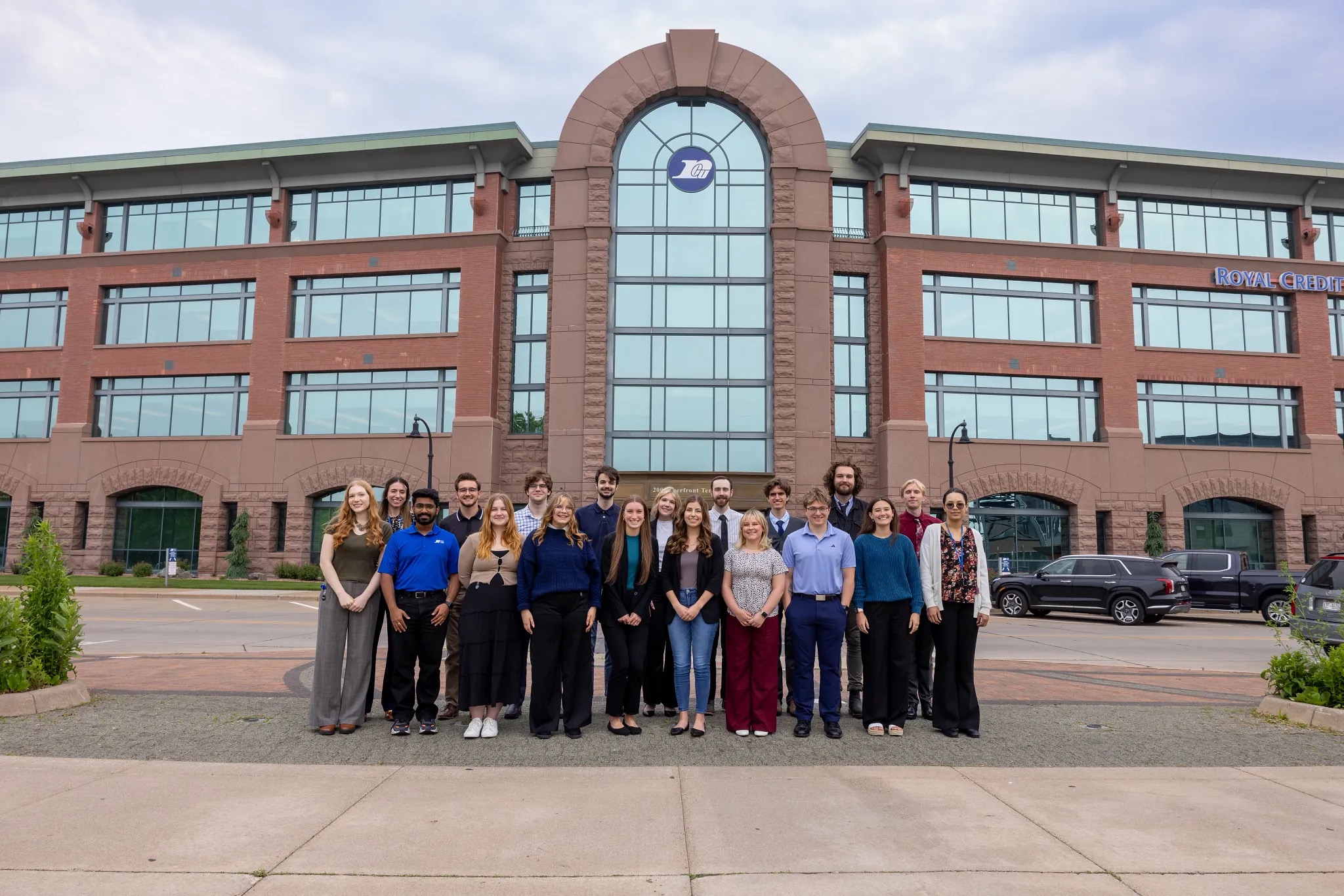 AI interns in front of Royal Credit Union Corporate Central Building