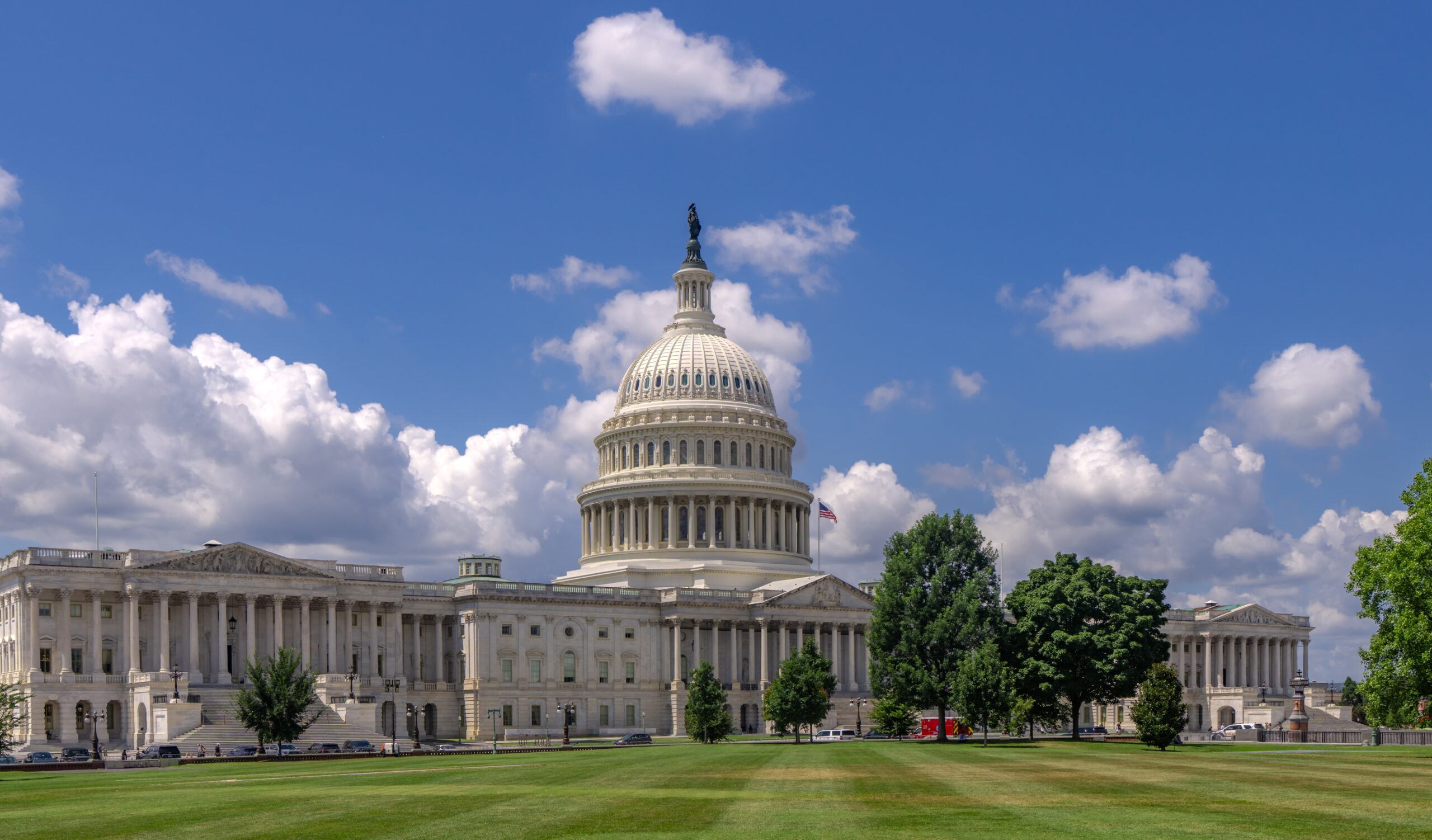 Washington DC Capitol building. Congress on Capitol Hill in Washington DC. American flag over Capitol. Washington DC landmark. Senate and House in Washington D.C..