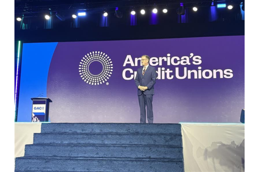 Photo of Scott Simpson on stage at the Governmental Affairs Conference