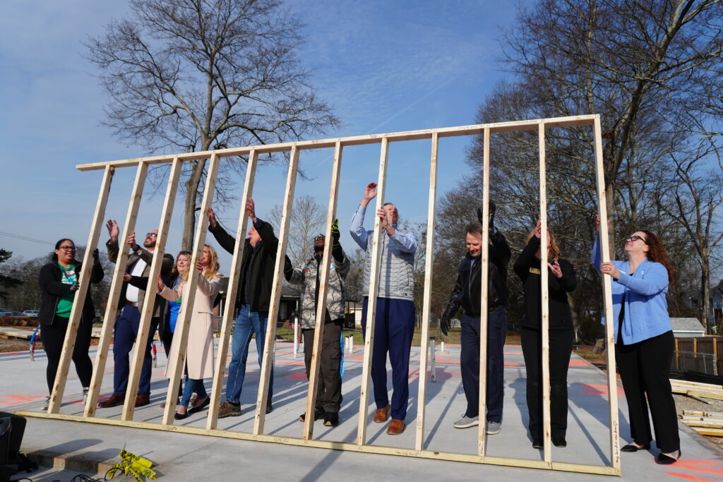 Credit union leaders raise a wall on a future home as part of the 2026 Credit Union Build in partnership with Habitat for Humanity Greenville County in Greenville, S.C