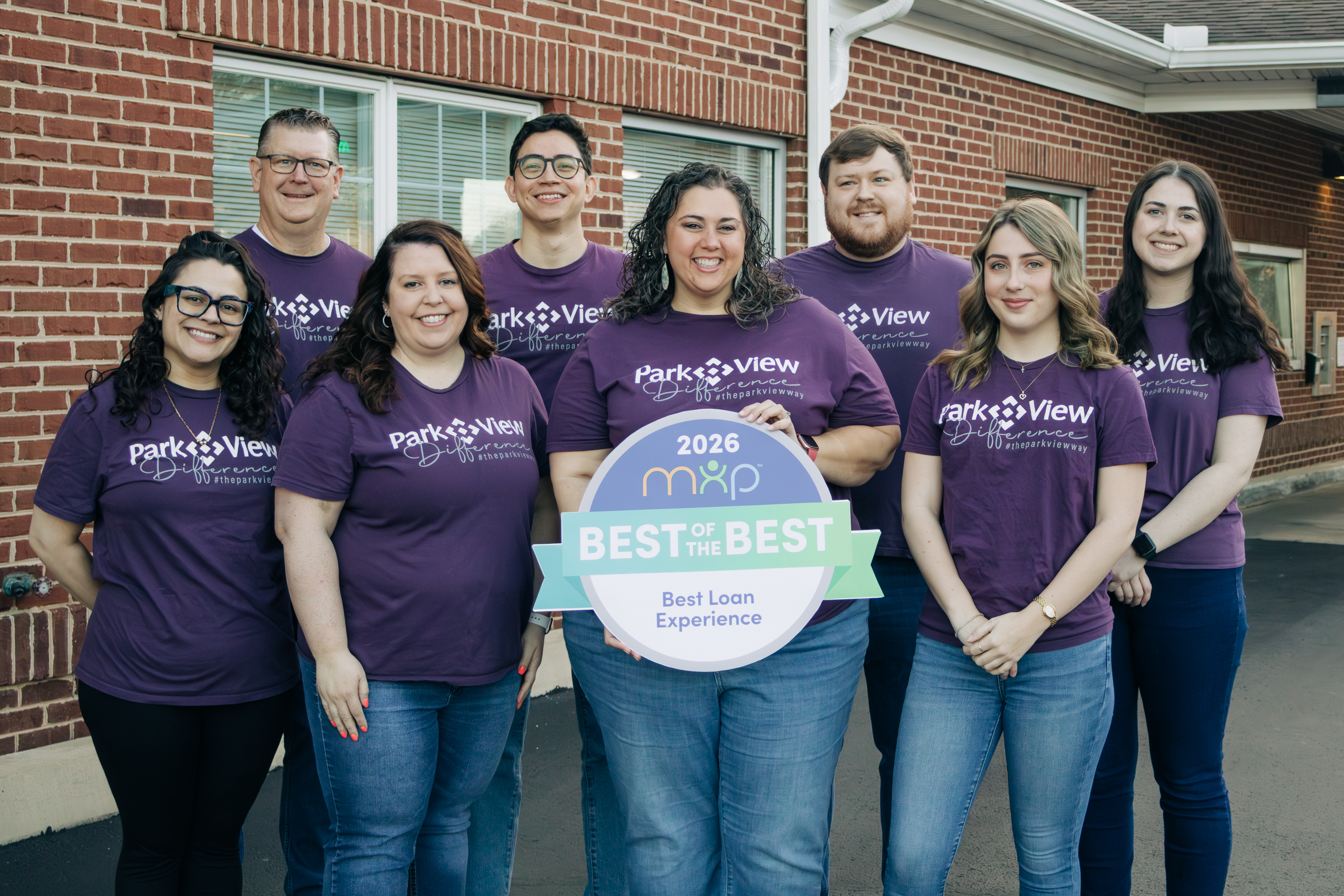 group of Park View Federal Credit Union employees with a best of the best sign