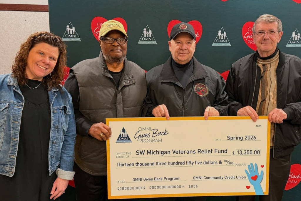 Representatives from OMNI Community Credit Union present a $13,355 donation through the OMNI Gives Back Program to the Southwest Michigan Veterans Relief Fund, supporting local veterans and their families.