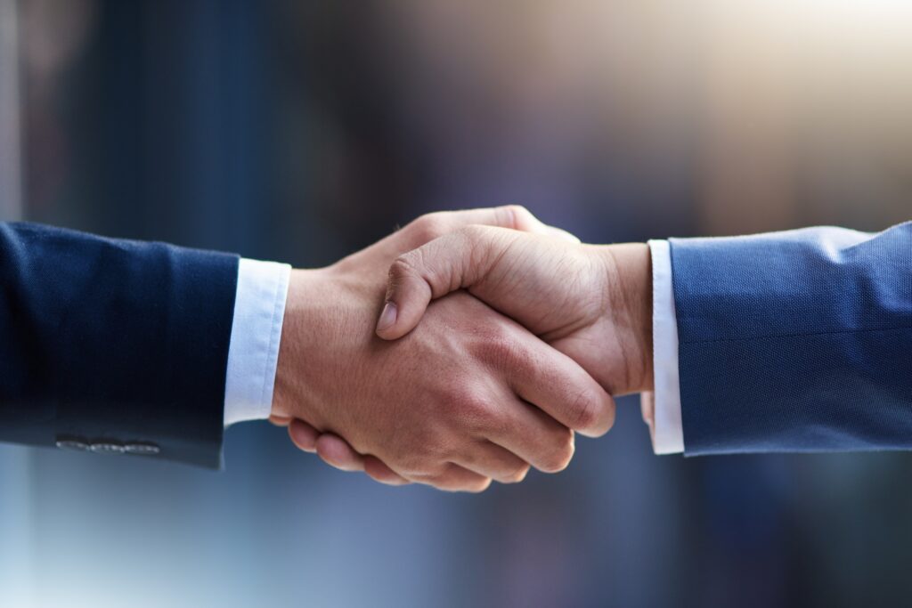 Business, agreement or handshake with zoom for cooperation, welcome or thank you for meeting. Partnership, shaking hands or contact with greeting for b2b or teamwork, collaboration or success