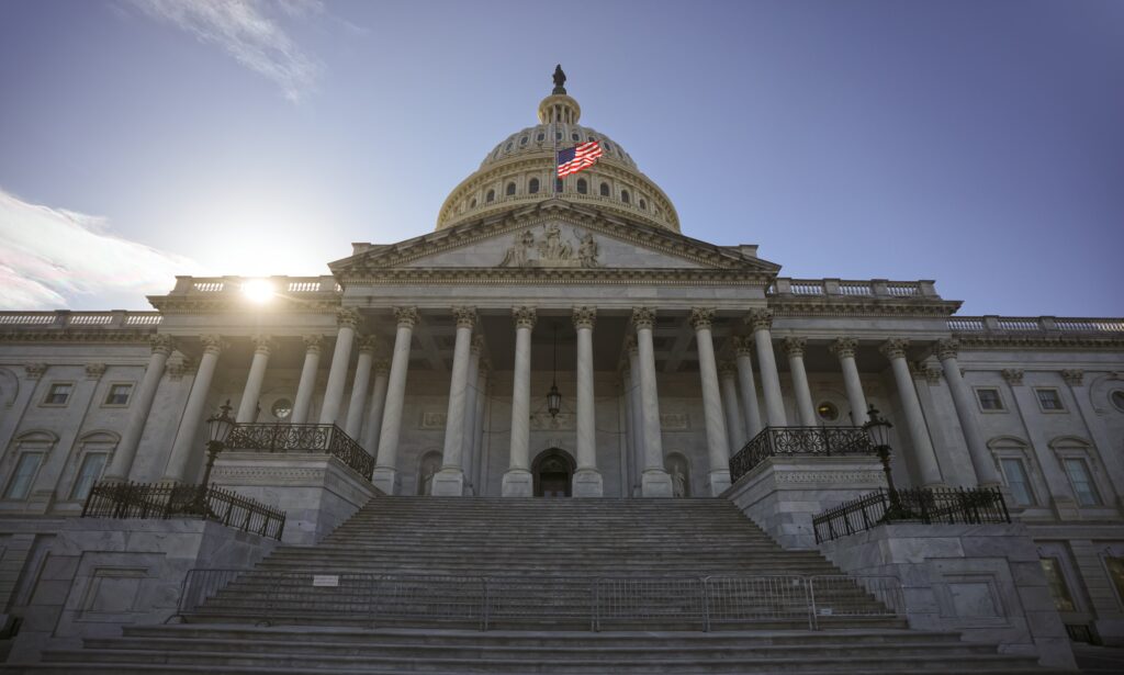 Capitol dome in Washington, DC. The state capitol buildings in Washington, DC. The Congress in Washington, DC. American flag waving. The Capitol Hill in Washington, DC.