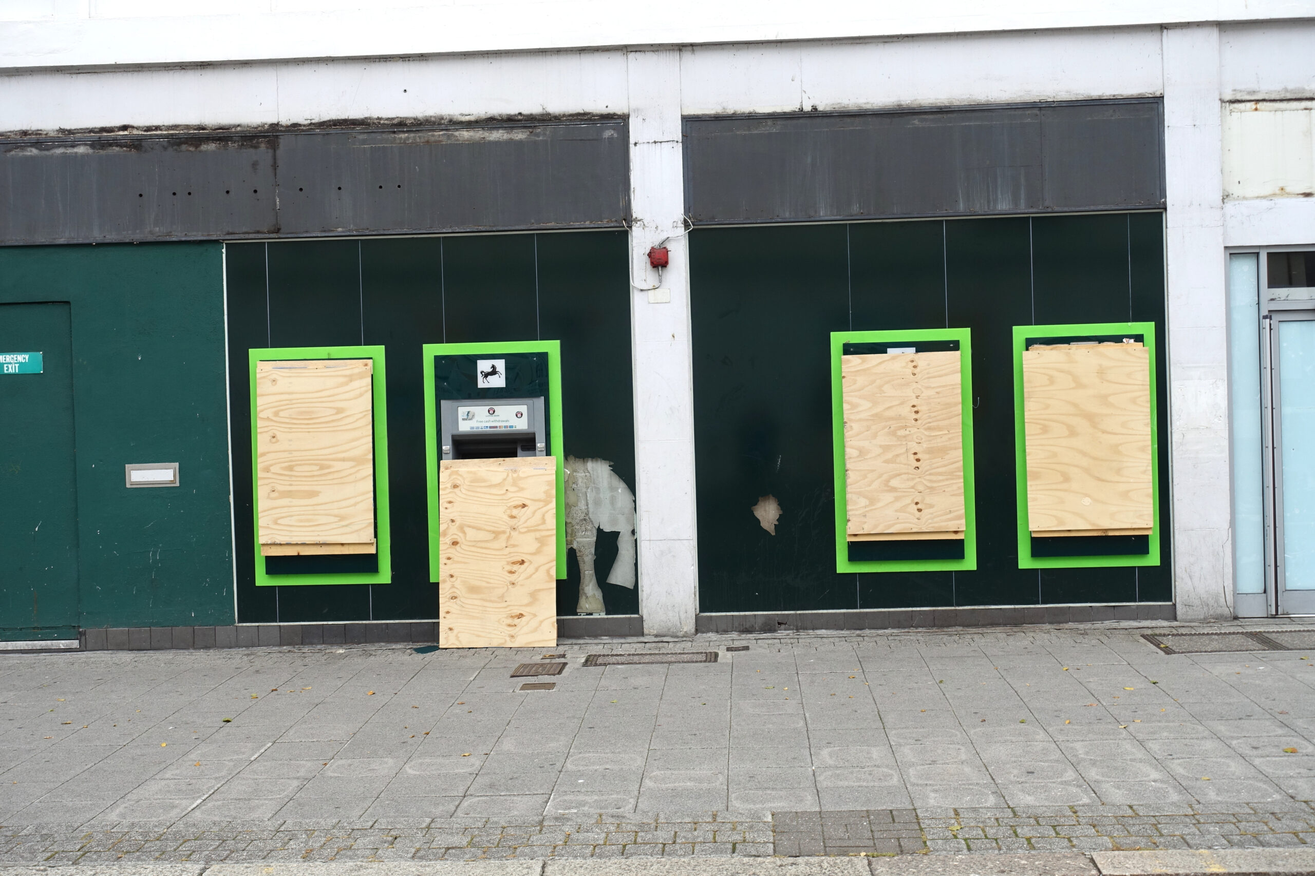 Bank closure. city centre. Four outside cash dispensing machines being boarded up. All signage has been removed