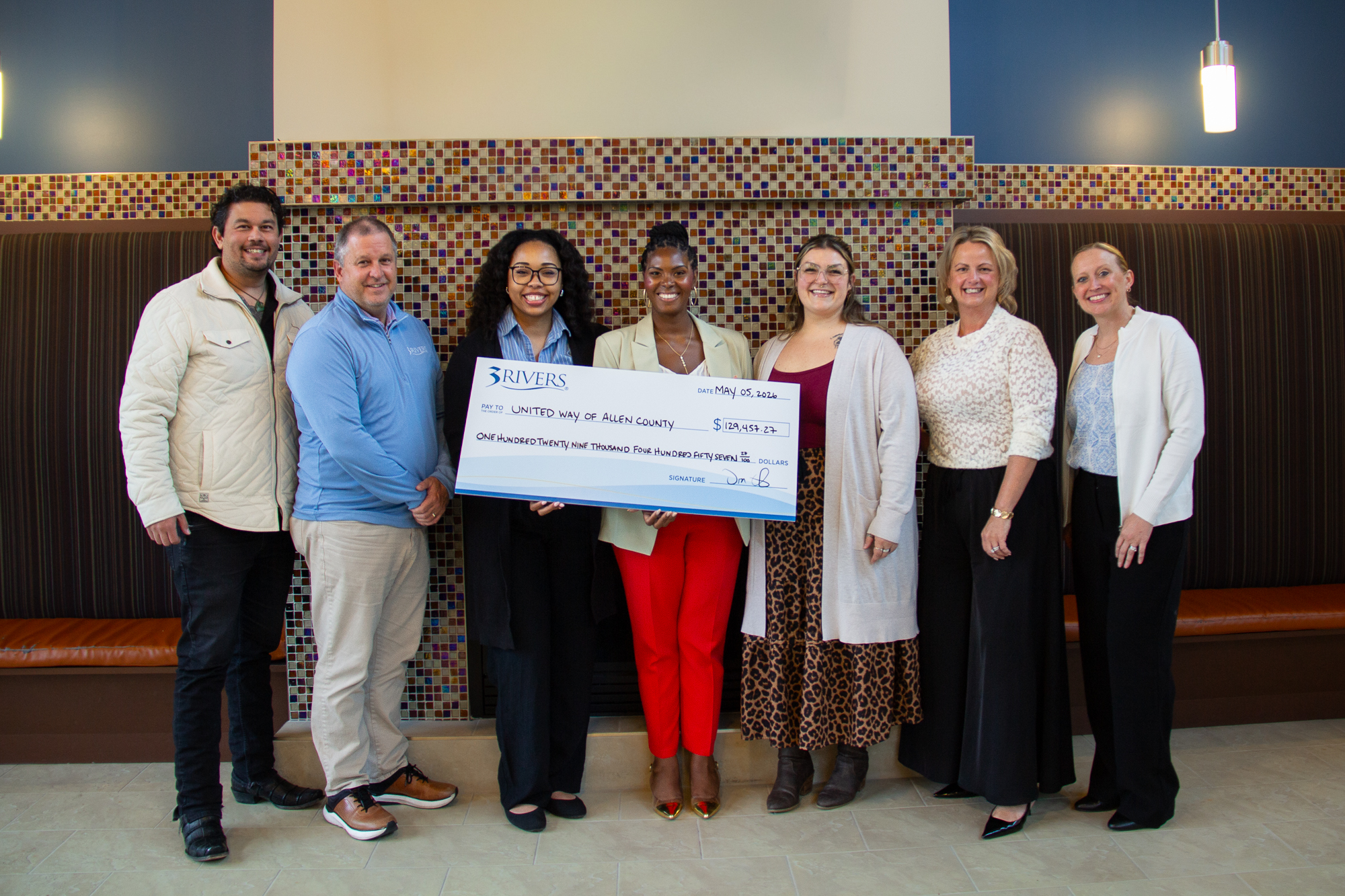 big check donation presentation with employees from 3Rivers Credit Union and the United Way of Allen County